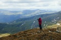 Female silhouette photographer in action. mountain landscape.Nature photography