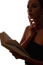 female silhouette reading pensive woman with book