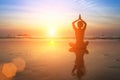 Female silhouette in yoga Lotus pose on the beach Royalty Free Stock Photo