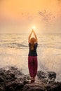 Beautiful yoga meditation reflection on water Goa beach on sunset Royalty Free Stock Photo