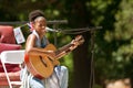 Female Singer Plays Guitar And Sings At Festival