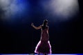 Female singer on the stage holding a microphone. Royalty Free Stock Photo