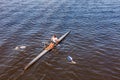 Female single scull rowing competitor. Royalty Free Stock Photo