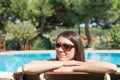 Female Sits Near By Swimming Pool at Summer Time Phone Bin ozcaada