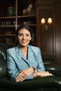 Female sitting in chair.