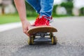 Skateboarder riding skateboard through the street Royalty Free Stock Photo