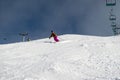 Female skier carving down an Australian ski slope Royalty Free Stock Photo