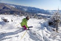 Female skier descending the hill