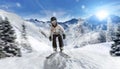 Female skier downhill skiing alpine mountain environment Royalty Free Stock Photo