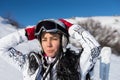 Female Skier with Hands Behind Head on Sunny Day