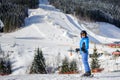 Female skier on a ski slope at a sunny day Royalty Free Stock Photo