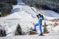 Female skier on a ski slope at a sunny day Royalty Free Stock Photo