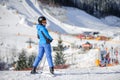 Female skier on a ski slope at a sunny day Royalty Free Stock Photo