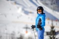 Female skier on a ski slope at a sunny day Royalty Free Stock Photo