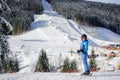 Female skier on a ski slope at a sunny day Royalty Free Stock Photo