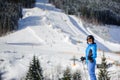 Female skier on a ski slope at a sunny day Royalty Free Stock Photo