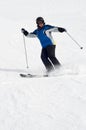 Female skier on ski trail, cloud of powder snow Royalty Free Stock Photo