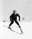 Female skier skiing downhill Royalty Free Stock Photo