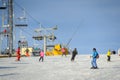 Female skier skiing downhill at ski resort Royalty Free Stock Photo