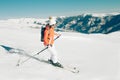 Female Skier skiing in mountain ski resort. Winter sport recreational activity