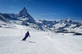 Female skier skiing on the slopes of Matterhorn mountain Royalty Free Stock Photo