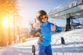 Female skier on the top of ski slope with ski-lift Royalty Free Stock Photo