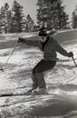 Female Skier Traversing Moguls At Colorado Ski Resort.