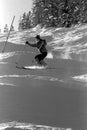 Female Skier Traversing Moguls At Colorado Ski Resort.