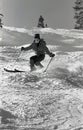 Female Skier Traversing Moguls At Colorado Ski Resort.