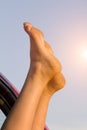 Female skin feet window car Royalty Free Stock Photo