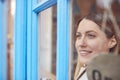 Female Small Business Owner Turning Around Open Sign On Shop Or Store Door Royalty Free Stock Photo