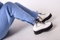 Female sneakers. White female shoes on feet. Sneakers closeup. Royalty Free Stock Photo