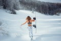 Female snowboarder hold snowboard and going to snowboarding