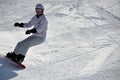 Female snowboarder in powder snow