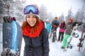 Female snowboarder on ski terrain