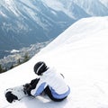 Female snowboarder strapping board onto feet. Conceptual image shot Royalty Free Stock Photo