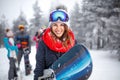 Female snowboarder on winter vacation