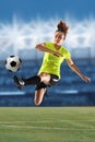 Female Soccer Player Kicking Ball Royalty Free Stock Photo