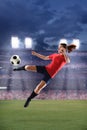 Female Soccer Player Kicking Ball Royalty Free Stock Photo