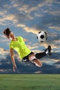 Female Soccer Player Kicking Ball Royalty Free Stock Photo