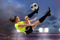 Female Soccer Player Performing Bicycle Kick Royalty Free Stock Photo