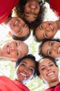 Female soccer team forming huddle