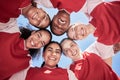 Female soccer team in a huddle smiling in unity and support in a circle. Below portrait of an active and diverse group Royalty Free Stock Photo