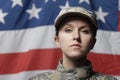 Female soldier in front of US flag