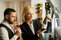 Female Sommelier Recommending Wine Royalty Free Stock Photo