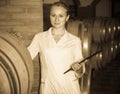 Female sommelier in wine cellar