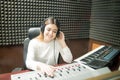 Female sound engineer working in recording studio