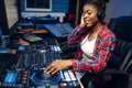 Female sound operator in audio recording studio