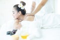 Female in spa. Young and healthy female in spa. Asian woman in wellness beauty spa having aroma therapy massage with essential oil Royalty Free Stock Photo