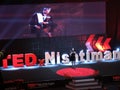 Female Speaker in front of Stage